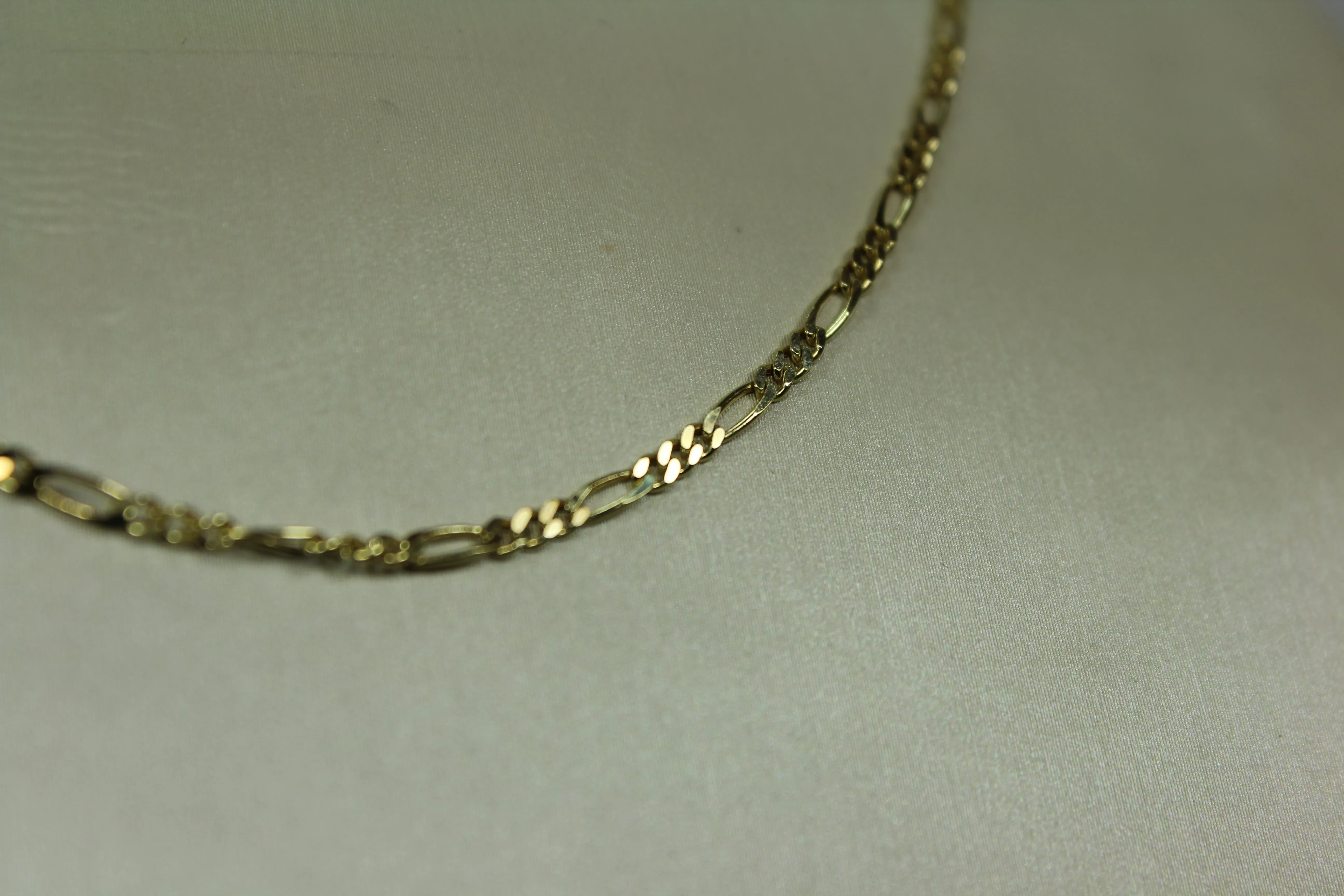 Solid 10k Figaro chain 1.9mm 16”